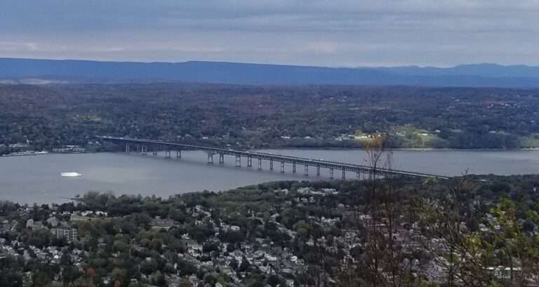 The Hudson River, the Newburgh-Beacon Bridge, and the rooftops of Beacon seen from the Mount Beacon summit