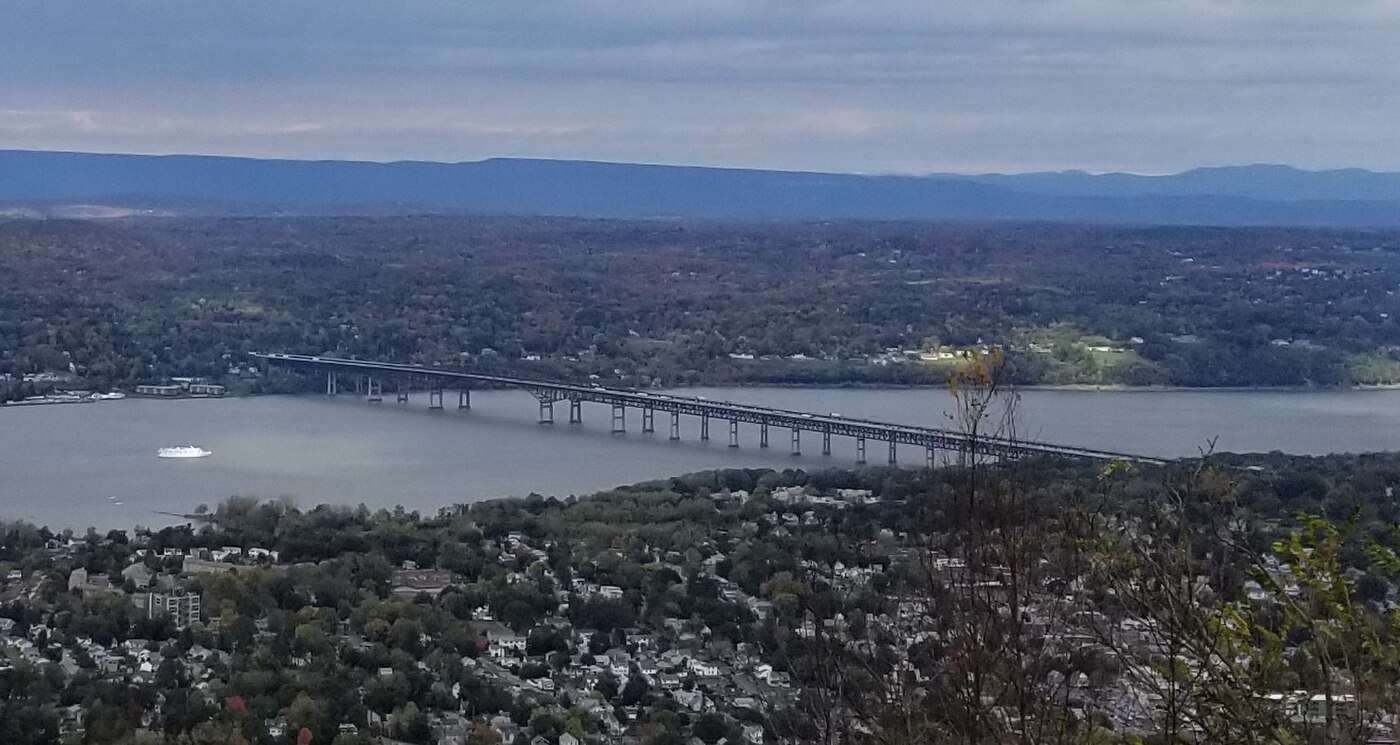 The Hudson River, the Newburgh-Beacon Bridge, and the rooftops of Beacon seen from the Mount Beacon summit